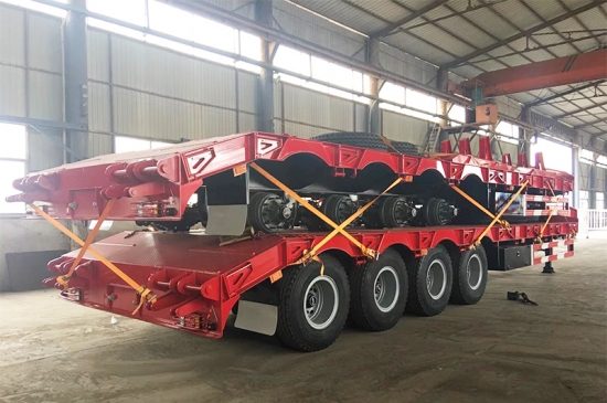 4 axles 80tons construction machinery carrier Low loader bed trailer with ramps